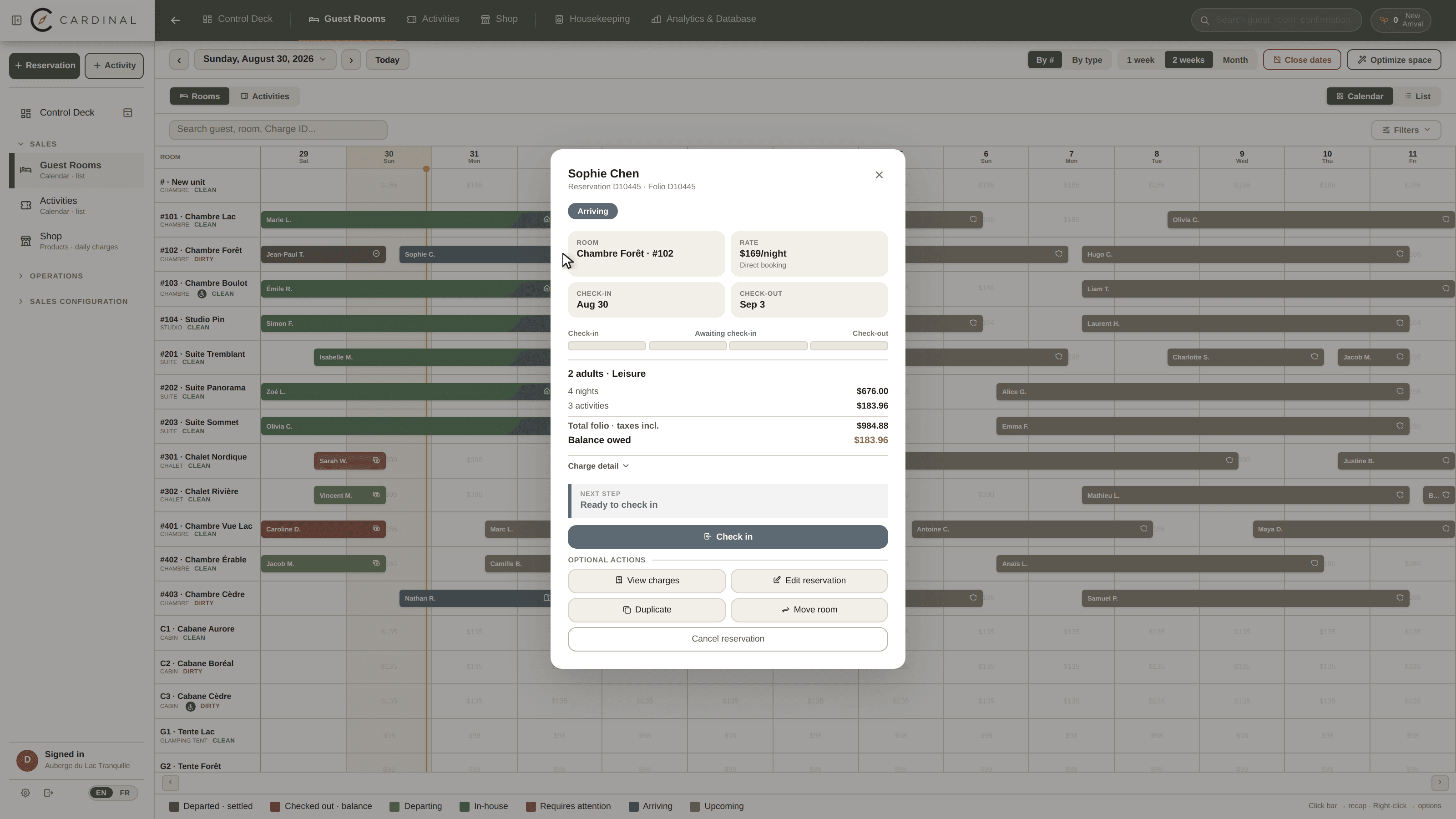 A Cardinal reservation over the room calendar: the stay, the balance, a next step reading Ready to check in with its Check in button, and the optional actions underneath